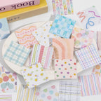 Assorted square journaling stickers with pastel plaid, watercolor, striped, dotted, and floral patterns