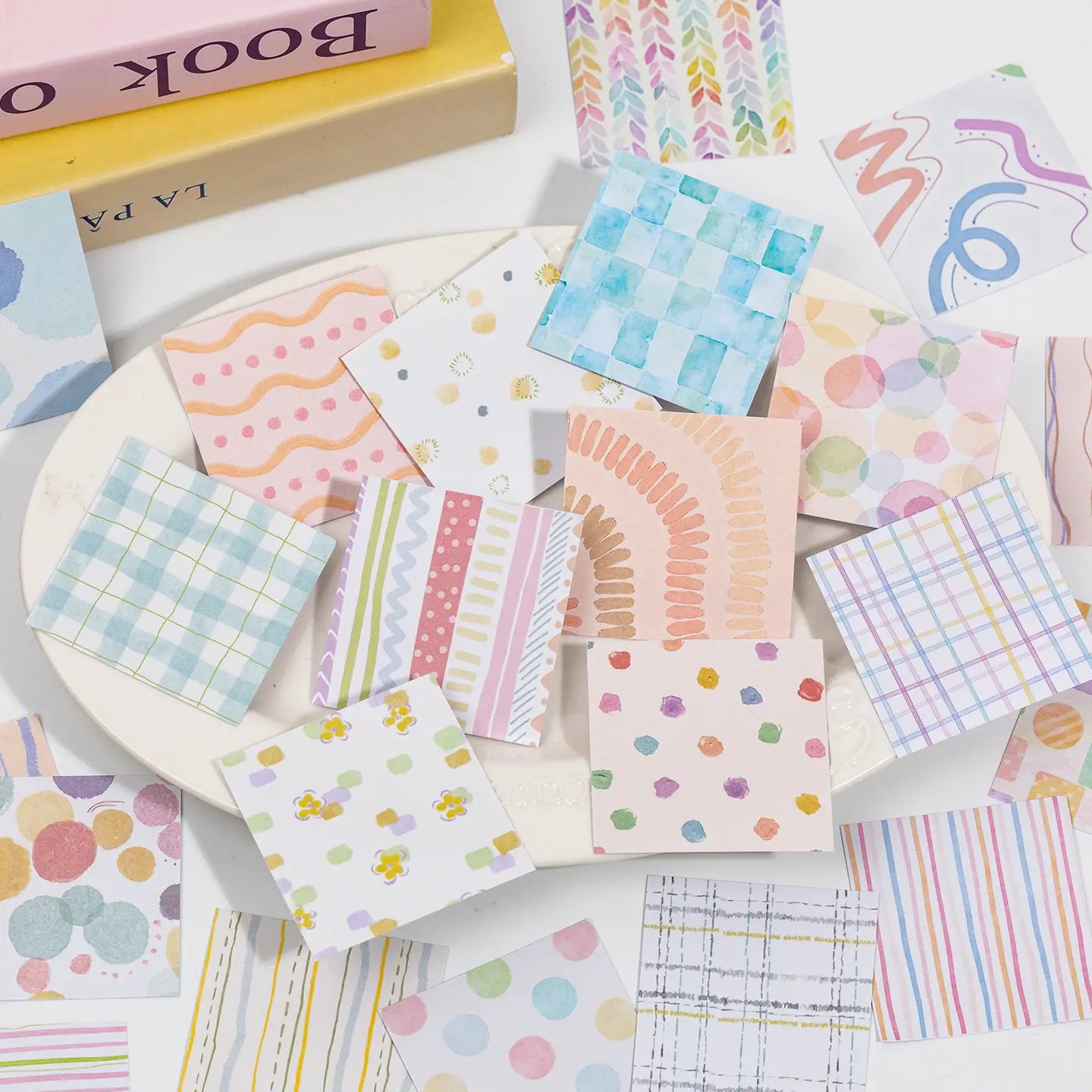 Assorted square journaling stickers with pastel plaid, watercolor, striped, dotted, and floral patterns