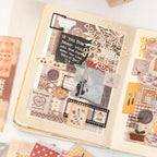 Close-up of a journal page decorated with brown patchwork stickers, lace, buttons, floral details, and vintage collage layers