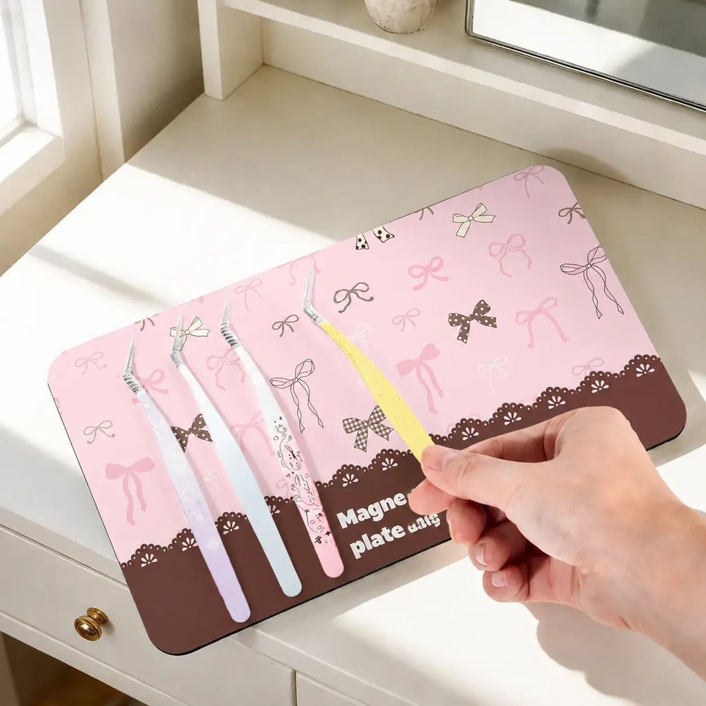 Pink bow magnetic storage board for organizing craft tweezers with self-adhesive backing and wall display use