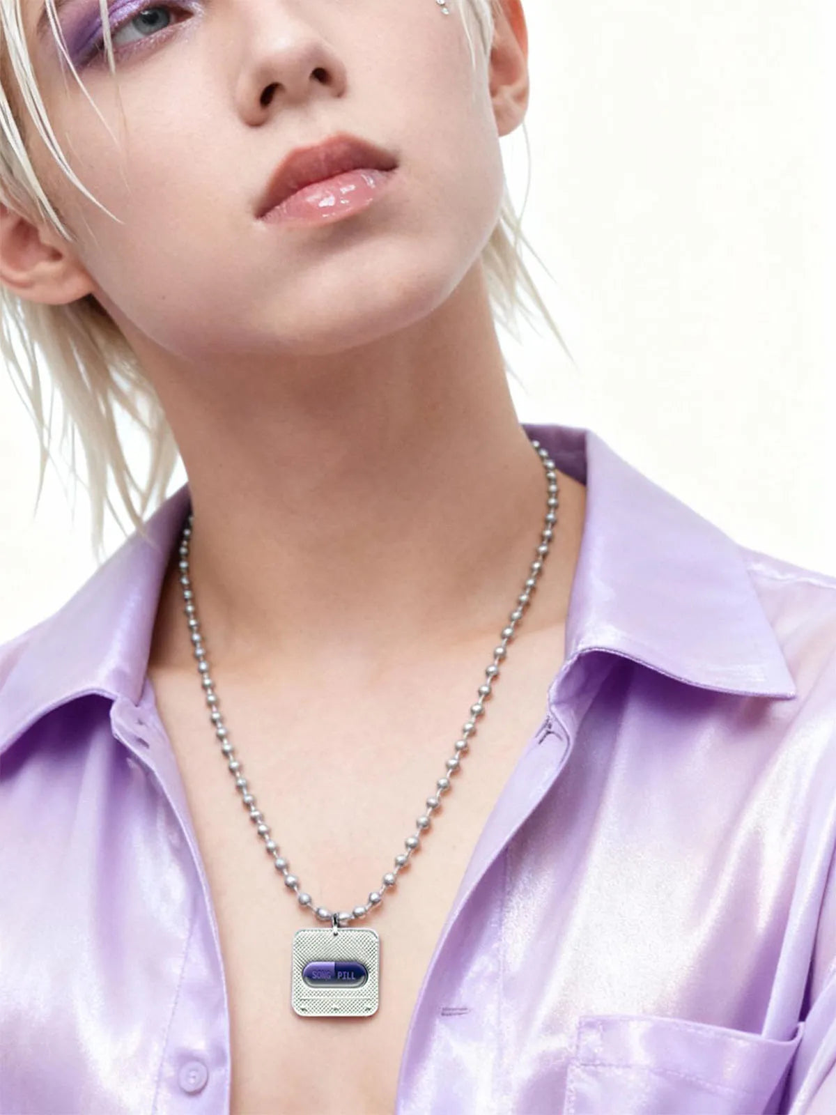 Y3K purple capsule NFC silver necklace worn by model, side view