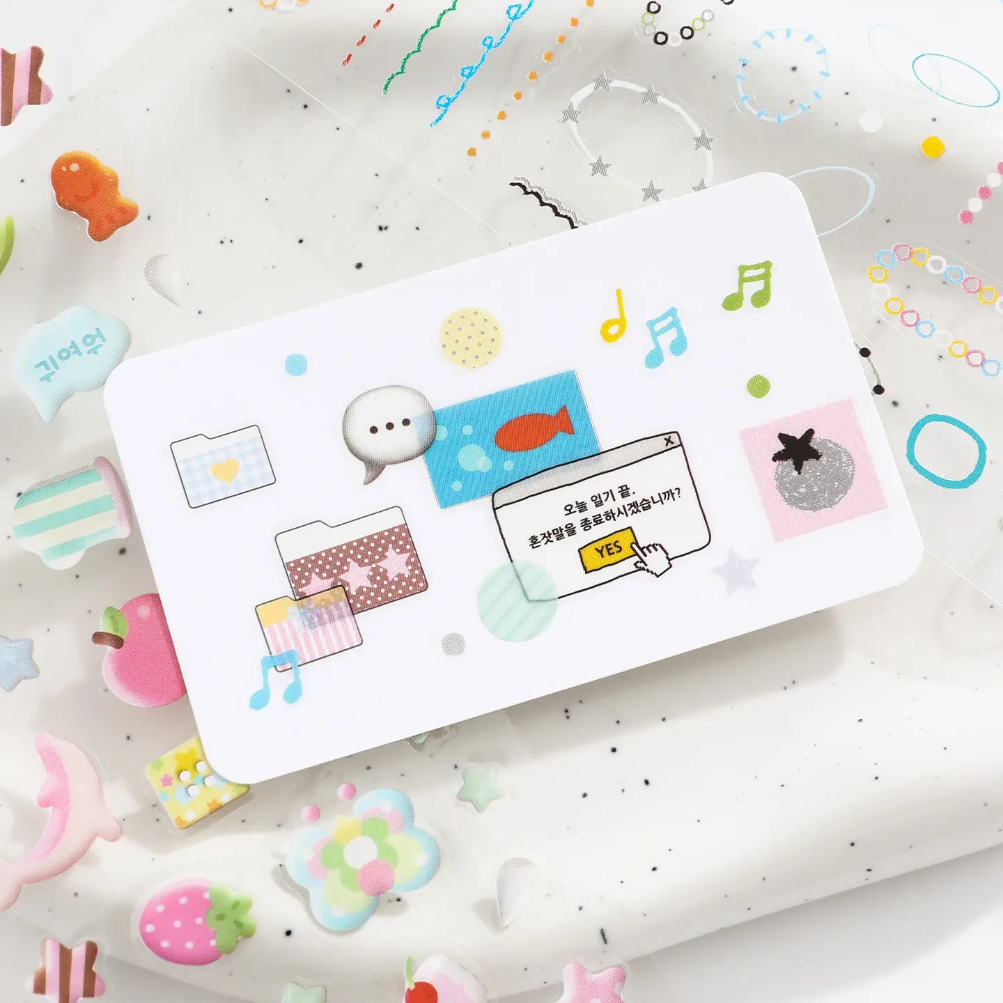 Close-up of a small PET sticker from the Quiet Notes Journaling Sticker Book with memo and music note details