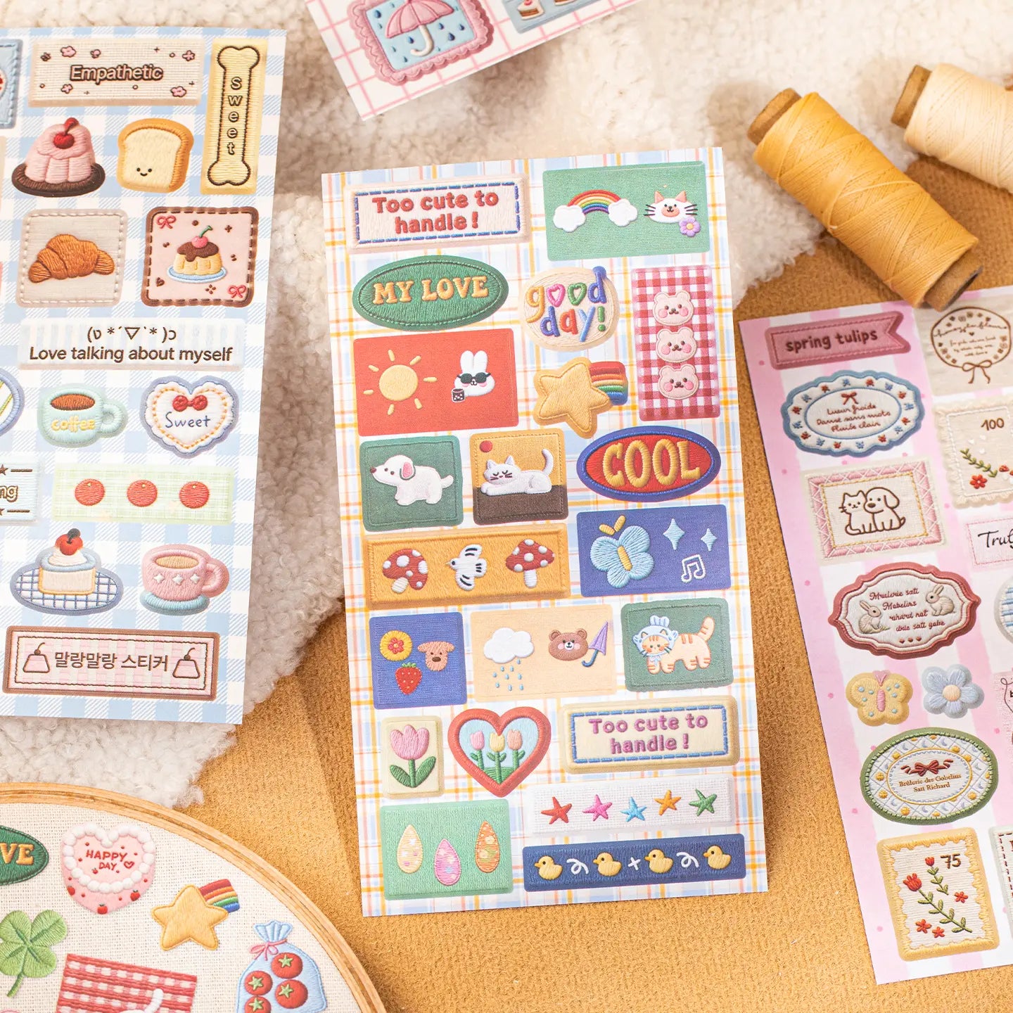 Rainbow Stitch sticker sheet with cats, dogs, rainbows, mushrooms, flowers, and decorative message labels