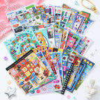 Flat lay of Retro & Future sticker sheets with colorful candy, toy, cyber, and pop-style designs