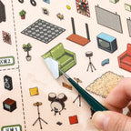Close-up of glossy PET stickers being peeled for the Retro Record Store miniature scene kit