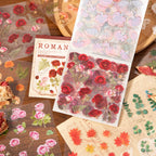 Romantic floral sticker sheets displayed with roses, maple leaves, eucalyptus, and botanical designs