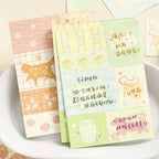 Secret Garden memo pad in use as planner paper, scrapbook note blocks, and decorative journal layers.