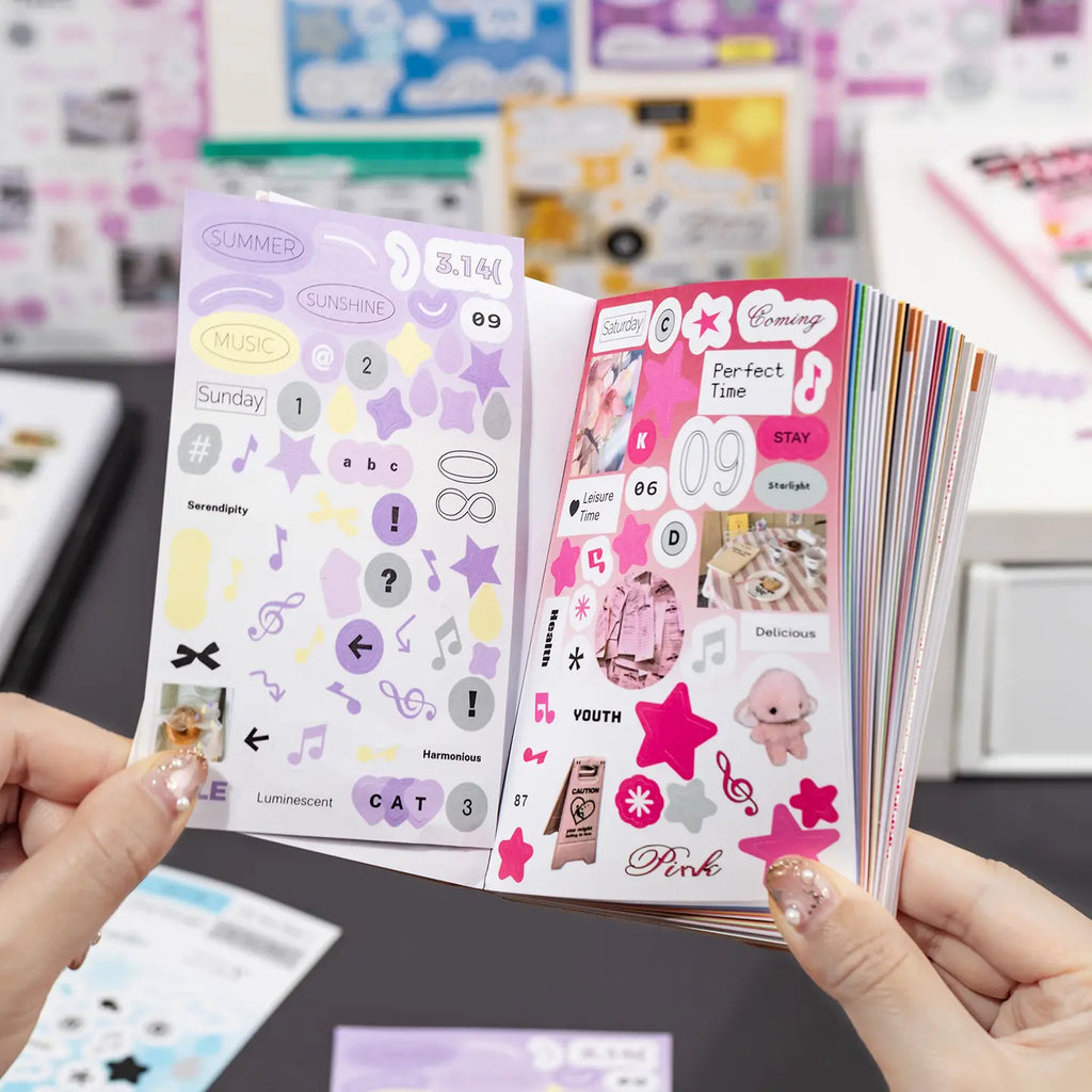 Hands flipping through the Simple Record journaling sticker set with colorful graphic sticker sheets