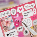 Close-up of Simple Record sticker sheets with purple, pink, blue, and music note designs
