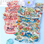 Sky City and Happy Birthday 3D-look scene sticker kits displayed together on a blue desk