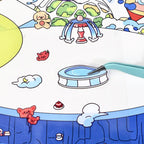 Close-up of a pool sticker piece being placed onto the Sky City scene with tweezers