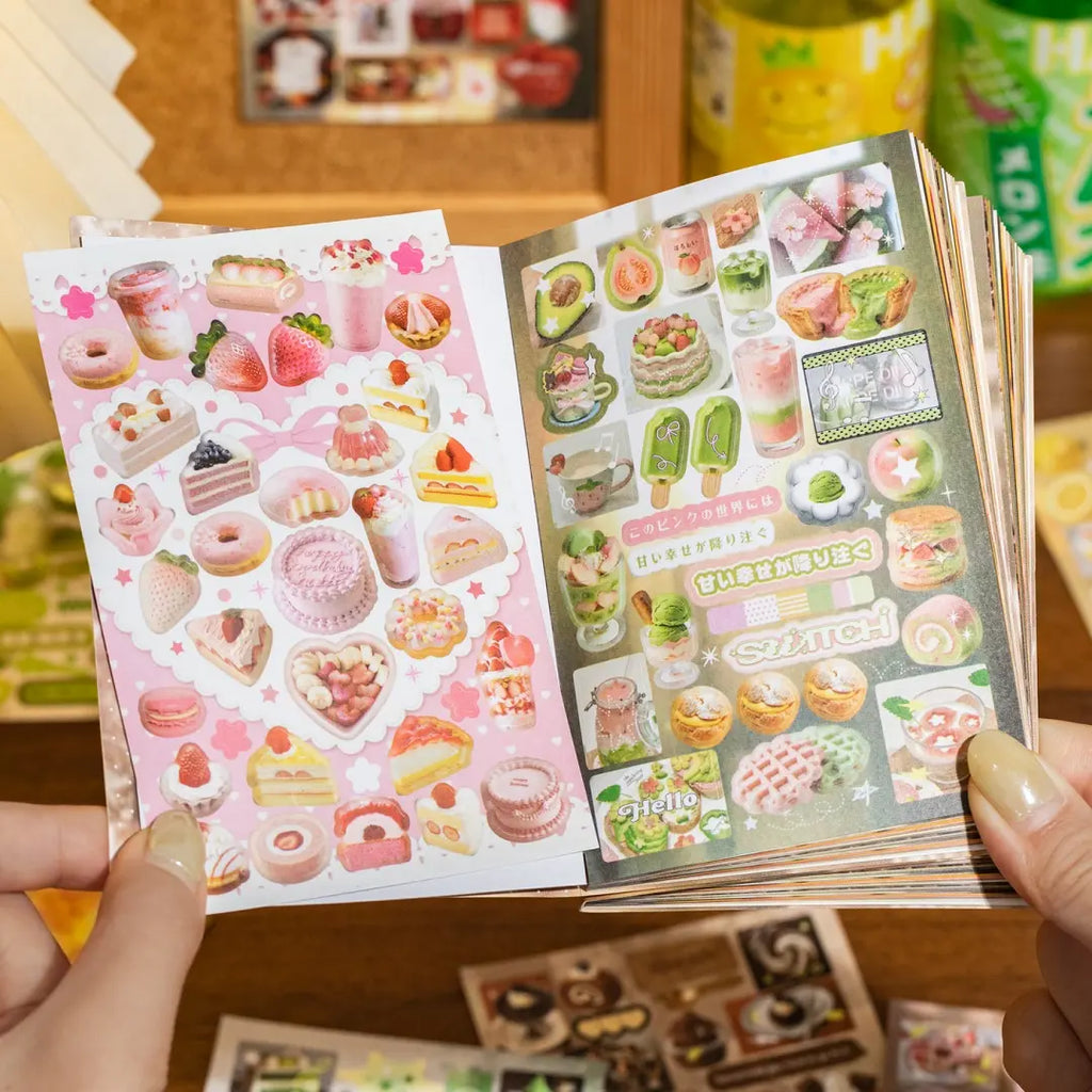 Open Snack Notes sticker book showing pink dessert stickers and green fruit dessert stickers inside the mini sticker book