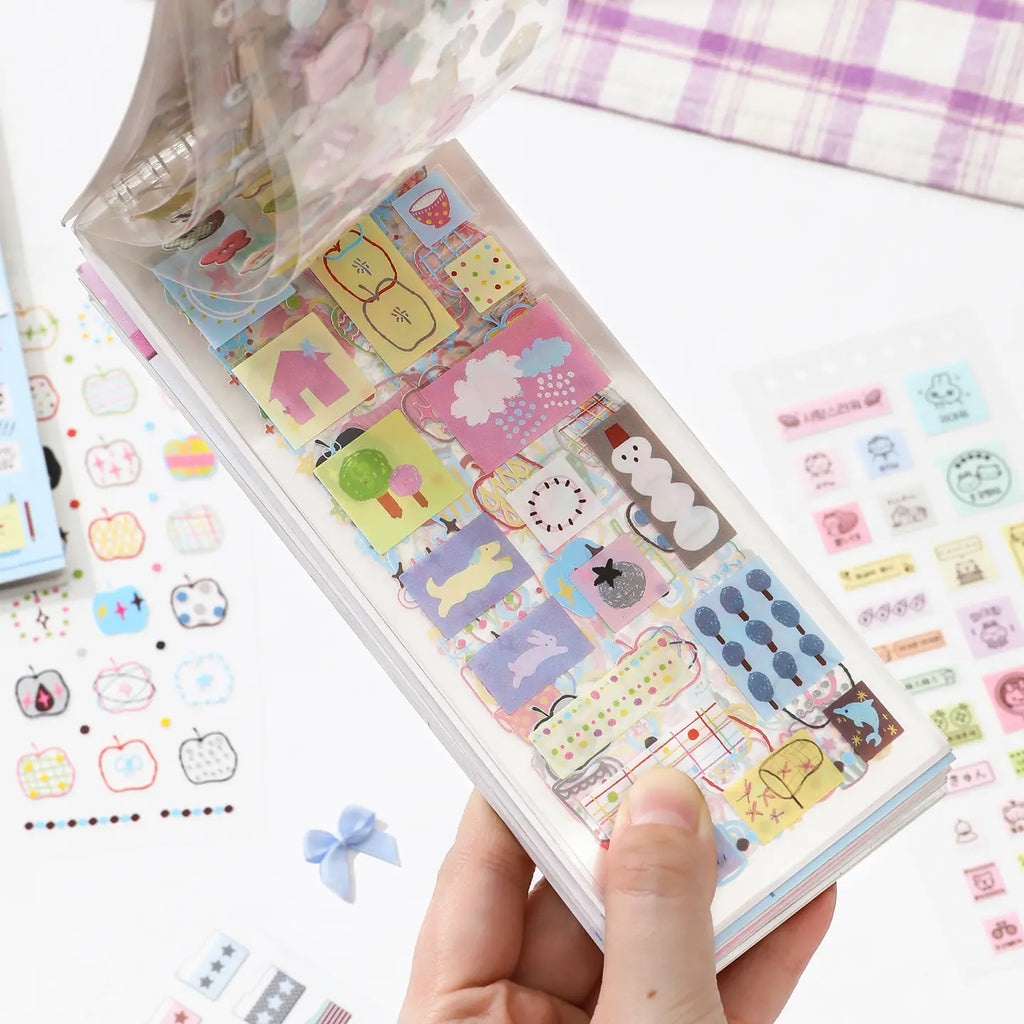 Soft Scripts Journaling Sticker Book opened to pastel memo label and icon sticker pages
