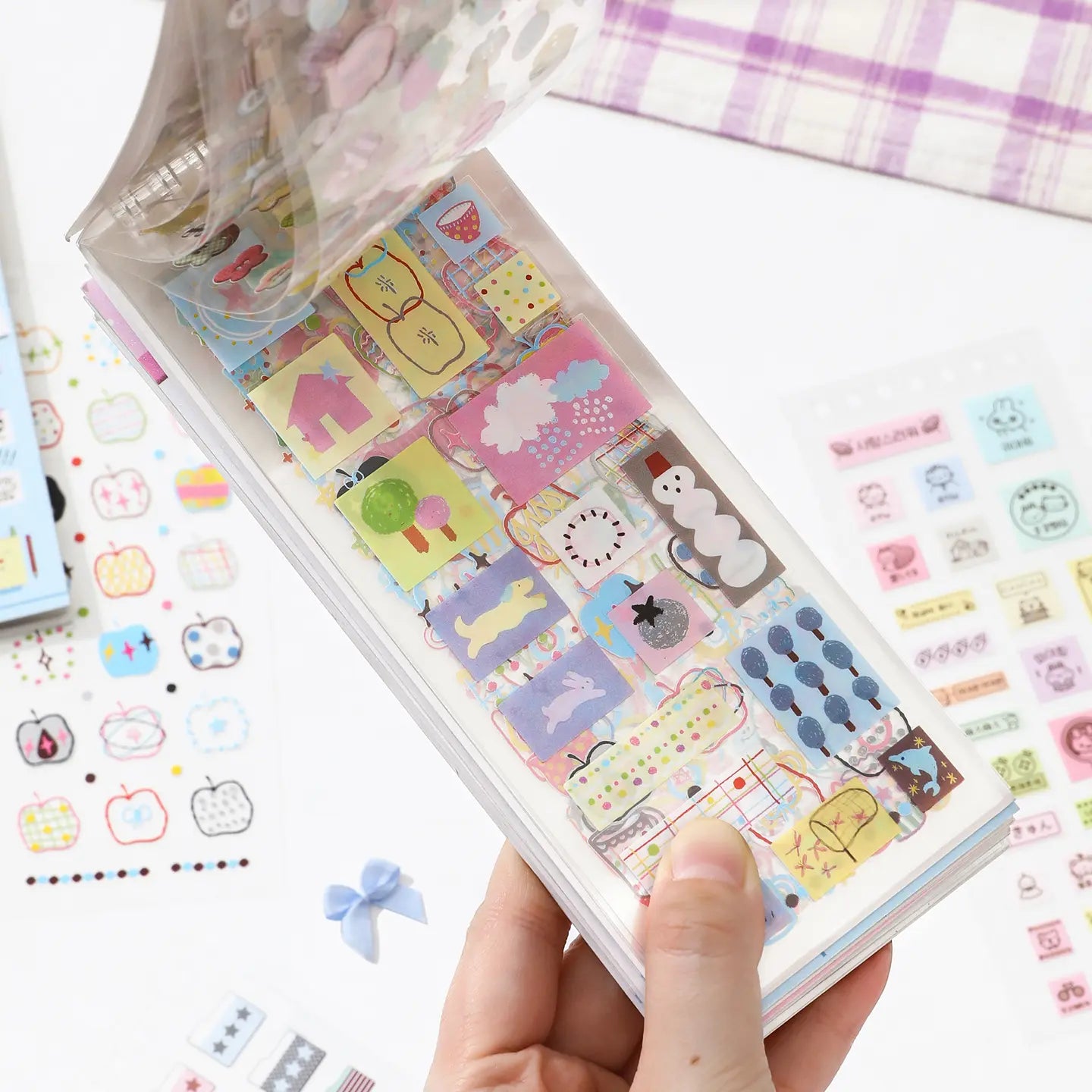 Soft Scripts Journaling Sticker Book opened to pastel memo label and icon sticker pages