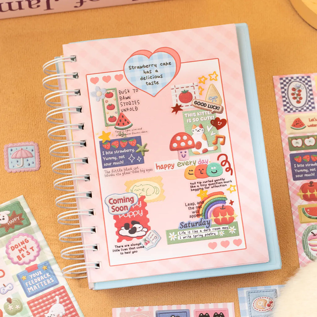 Pink journal page decorated with rainbow, animal, mushroom, fruit, and message stickers from the Stitch collection