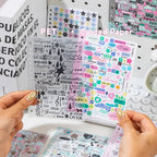 Strong Valley sticker sheets showing a matte transparent PET sheet beside a coated paper sheet with colorful words, stars, and graphic elements
