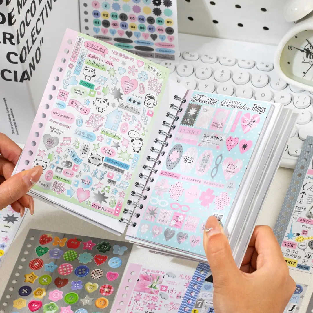 Open Strong Valley journaling sticker set showing pastel coated paper sticker sheets with hearts, speech bubbles, stars, and text accents