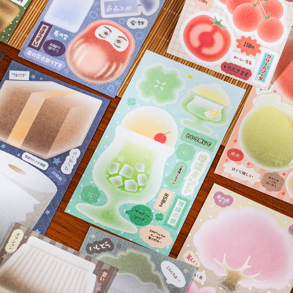 Close-up of Tasty Time sticker sheets with melon soda, tomatoes, peaches, sweets, and soft pastel memo shapes