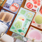 Close-up of Tasty Time sticker sheets with melon soda, tomatoes, peaches, sweets, and soft pastel memo shapes