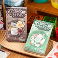 Tasty Time and Life Fragments journaling sticker sets displayed together in green and brown packaging