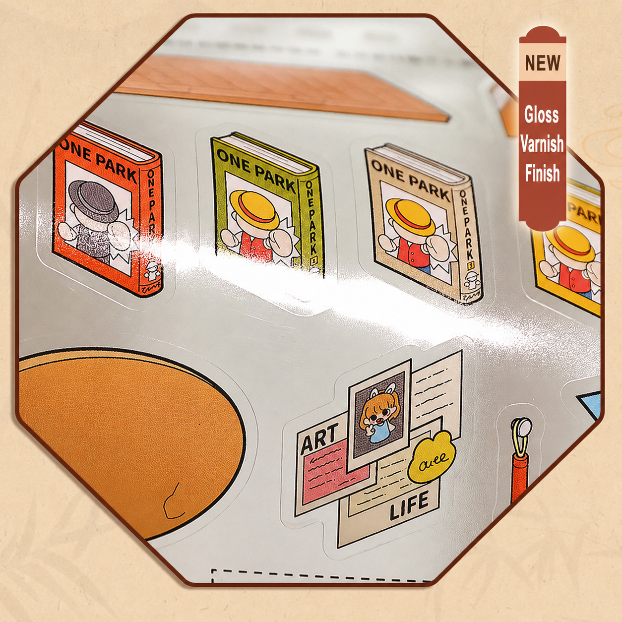 Close-up of gloss varnish detail on die-cut book and art stickers