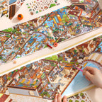 Hands building the Vermilion Pavilion fold-out scene with flat PET stickers