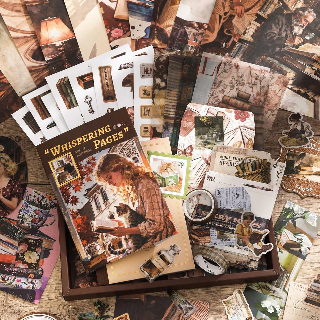 Vintage Paper Whispers Junk Journal Kit flat lay with vintage papers, stickers, cards, and ephemera for junk journaling