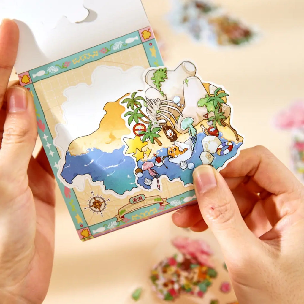 Hands placing a finished Woodland Town scene sticker onto a small illustrated base card